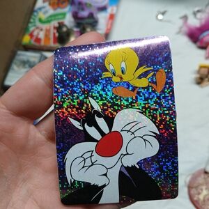 PRISM Holographic Trading Card with Yellow and Black Characters